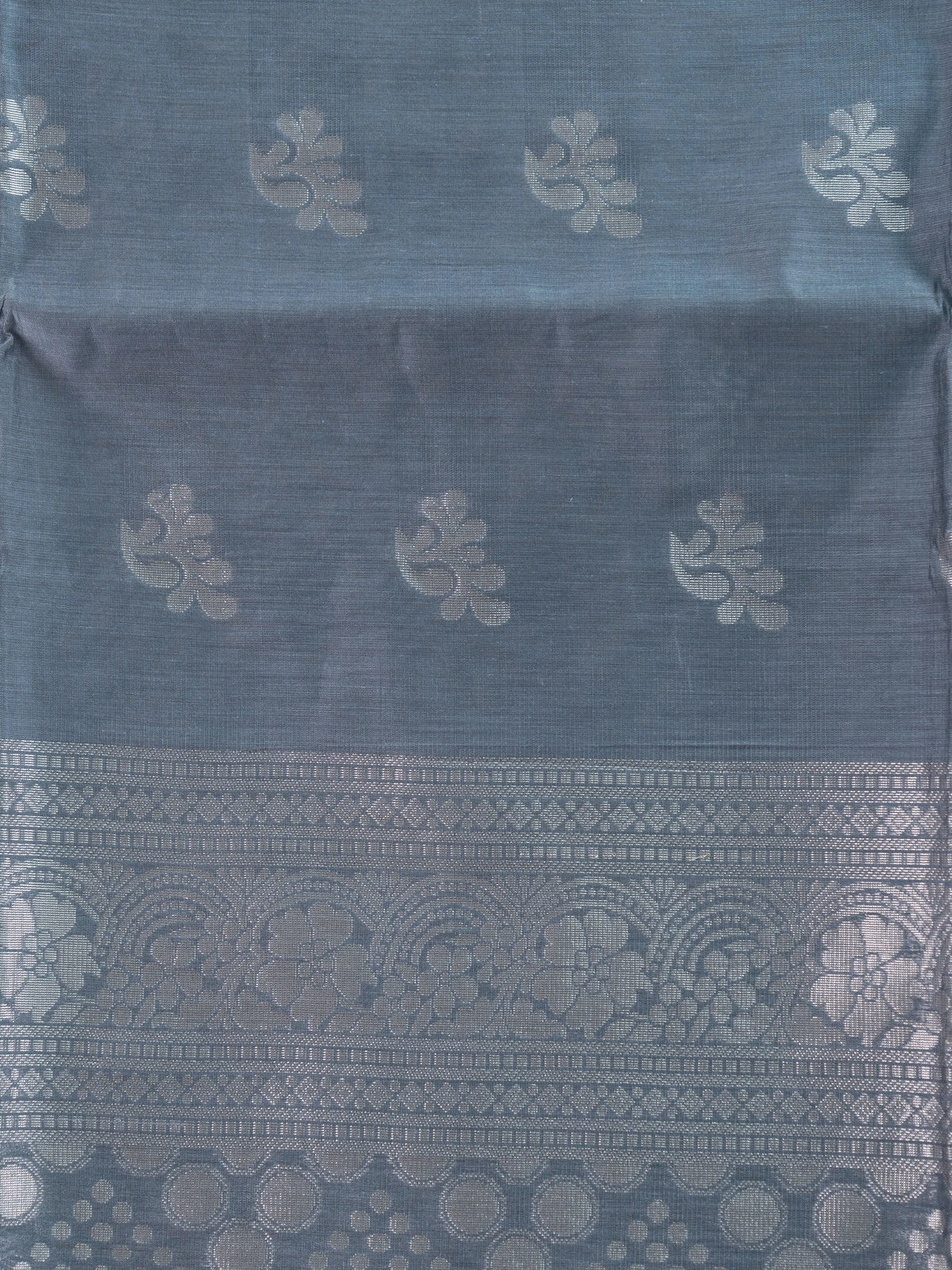 Grey silk cotton saree with silver zari floral buttas and ornate zari pallu