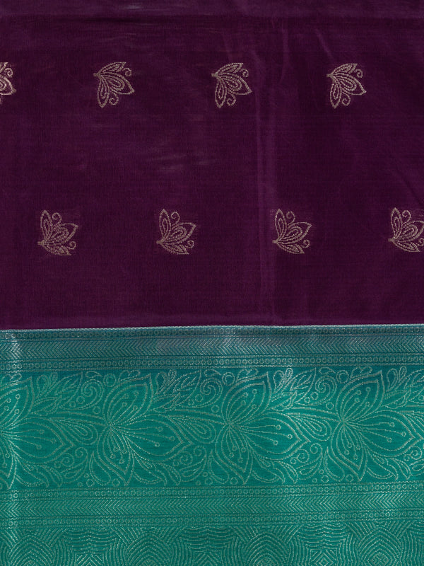 Purple silk cotton saree with teal-green contrast border and gold zari lotus motifs