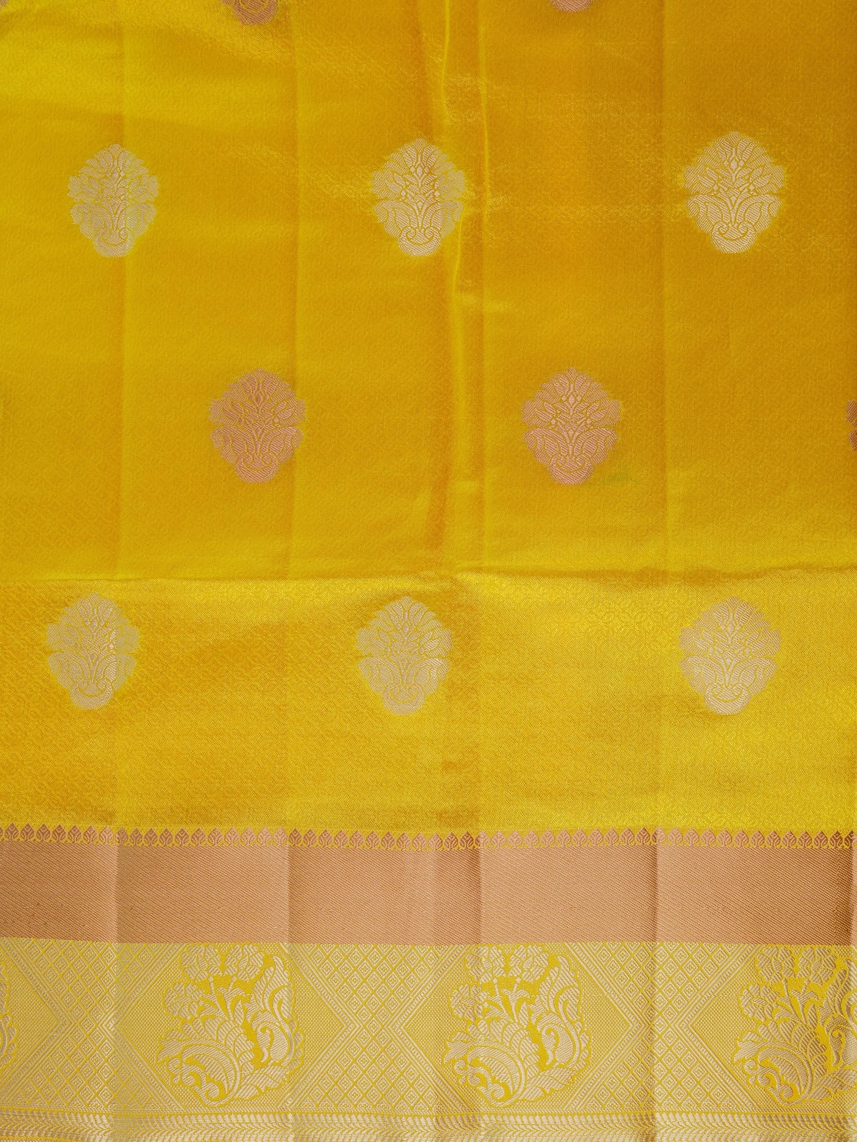 Bright yellow semi tussar saree with silver and gold zari butta motifs and contrast zari border