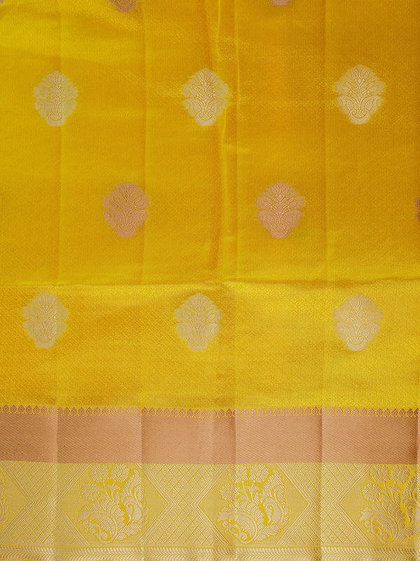Bright yellow semi tussar saree with silver and gold zari butta motifs and contrast zari border