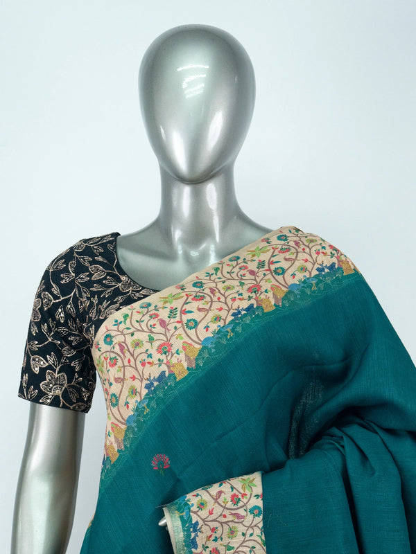 Teal green linen cotton saree with cream multicoloured floral border and black blouse