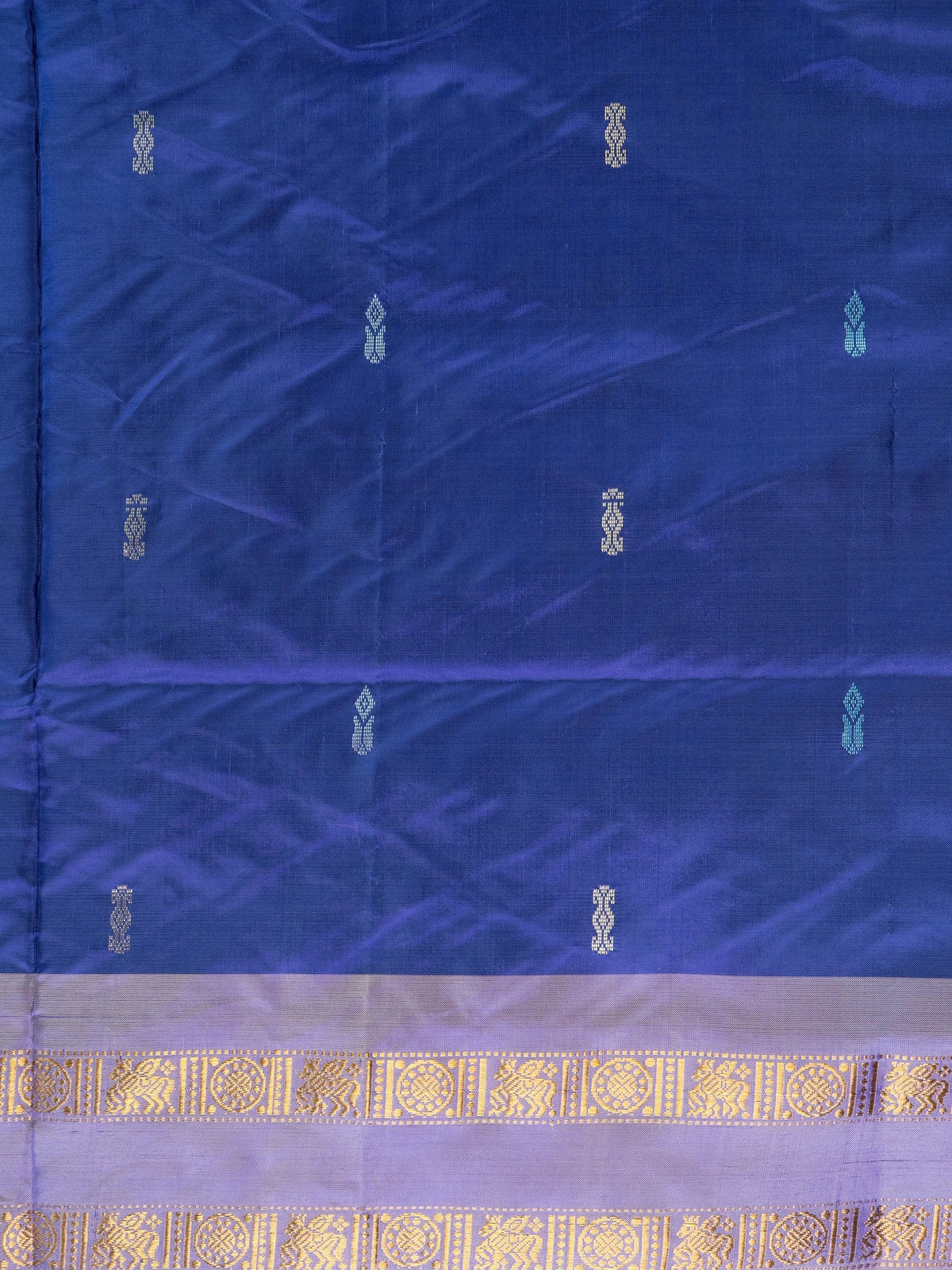 Royal blue banana silk saree with lavender-gold zari border and contrast beige striped pallu