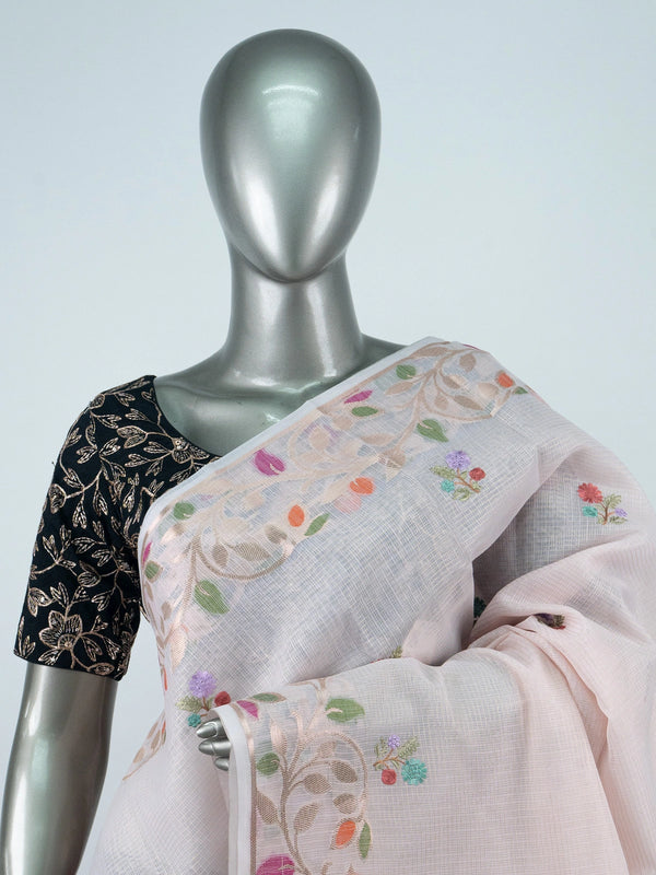 Blush pink linen cotton saree with multicolour floral buttas, gold zari floral border and contrast black embroidered blouse