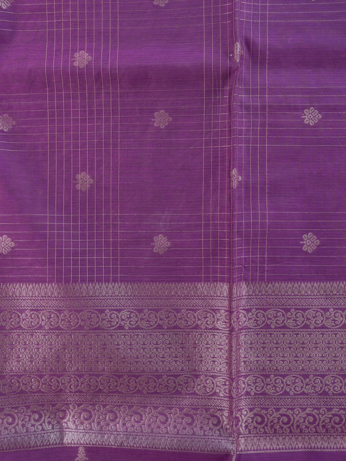 Purple silk cotton saree with silver zari checks, floral buttas and ornate woven border
