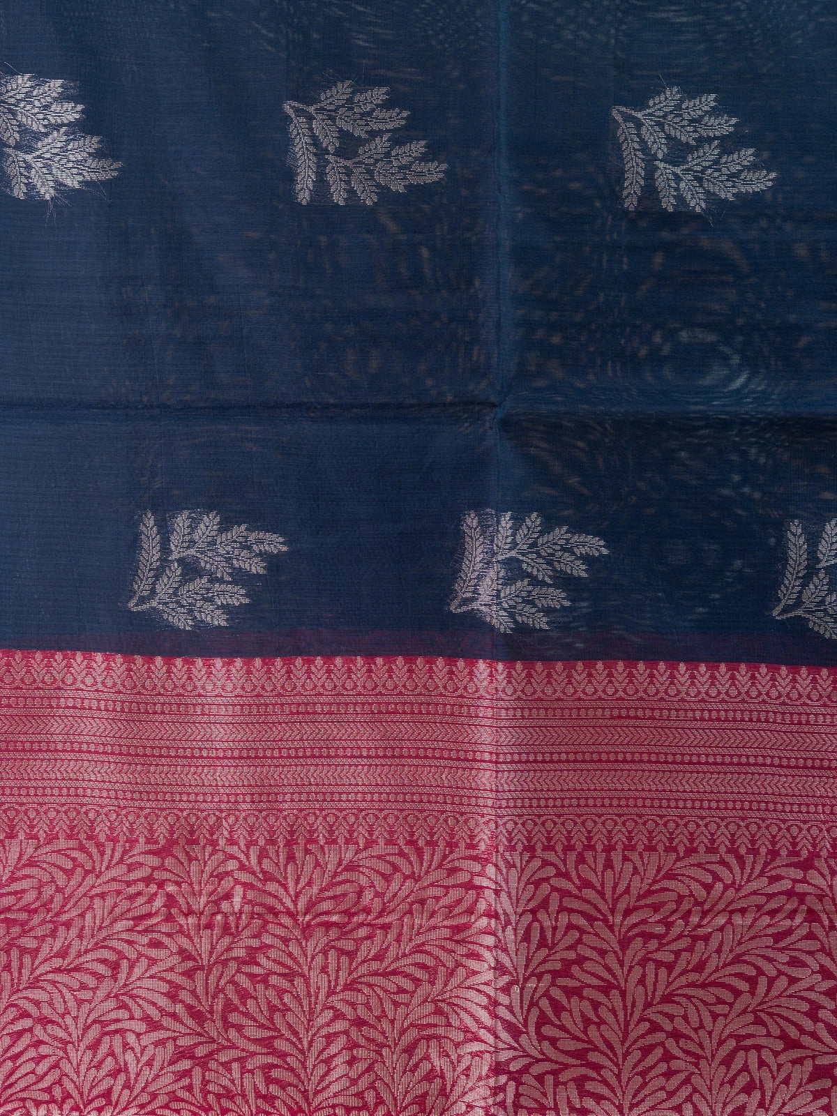 Navy blue silk cotton saree with silver butta motifs and contrast maroon pallu and border