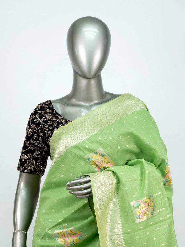 Pista green linen cotton saree with silver zari border and colourful floral buttas