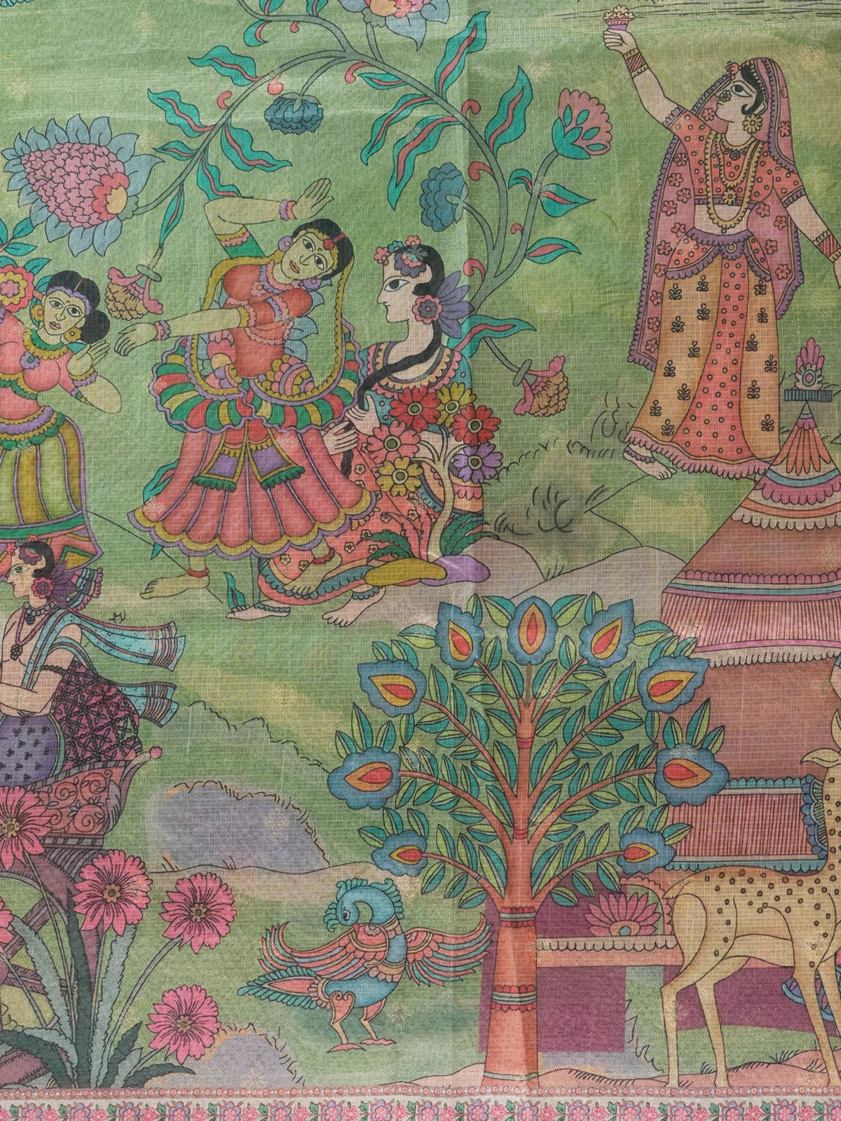 Green semi tussar saree with gold zari border, zari buttas and a multicolour Kalamkari printed pallu with a copper brown floral blouse