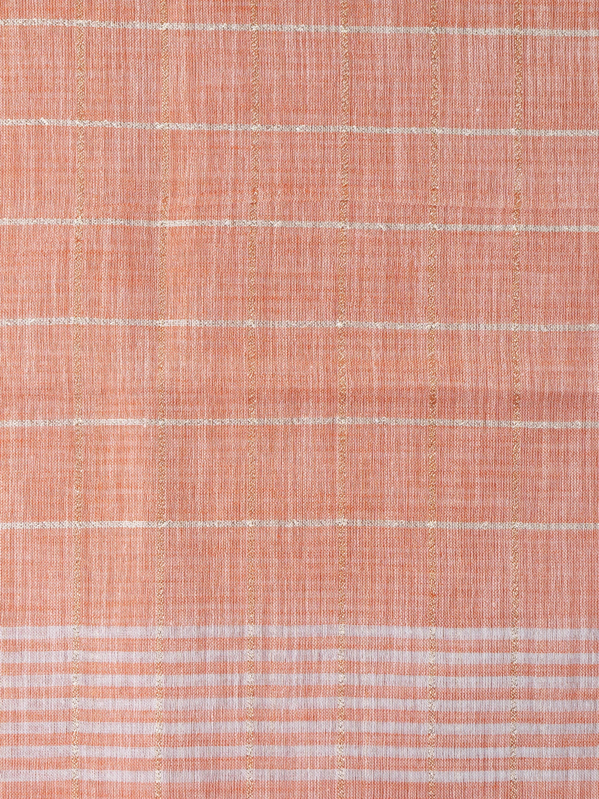 Peach linen cotton saree with white and gold zari checks and contrast striped border