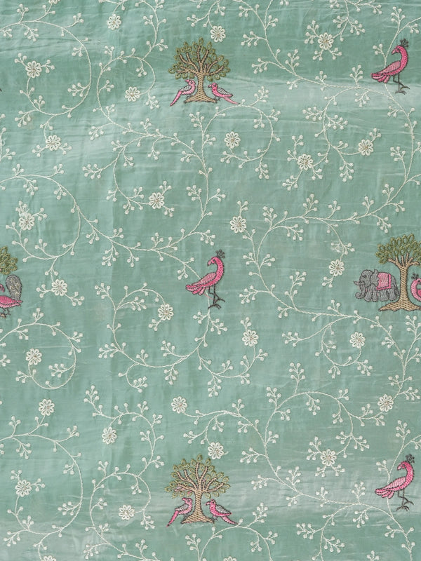 Sage green art silk designer saree with floral, bird and elephant thread embroidery and contrast aqua border