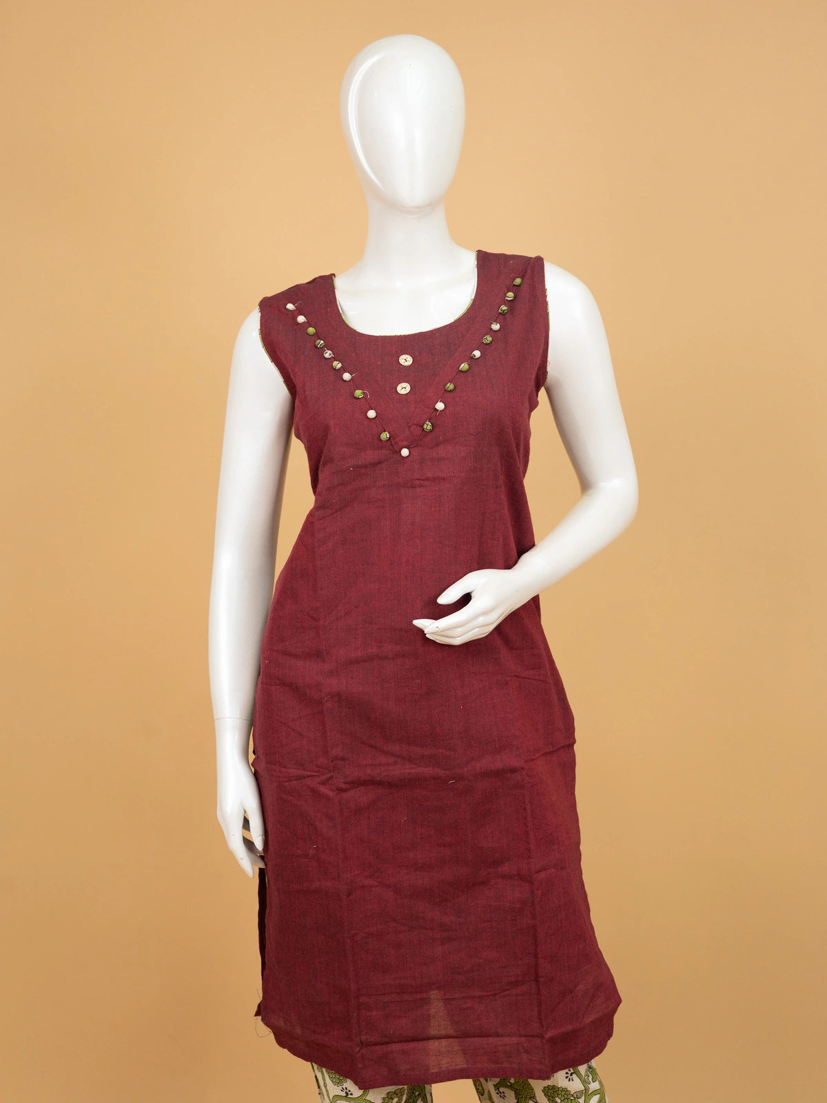 Maroon cotton straight cut kurti set with pom-pom neckline, green kalamkari printed pants and contrast kalamkari dupatta