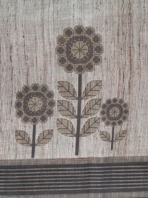 Beige linen cotton saree with grey floral prints and a contrast grey-black striped border