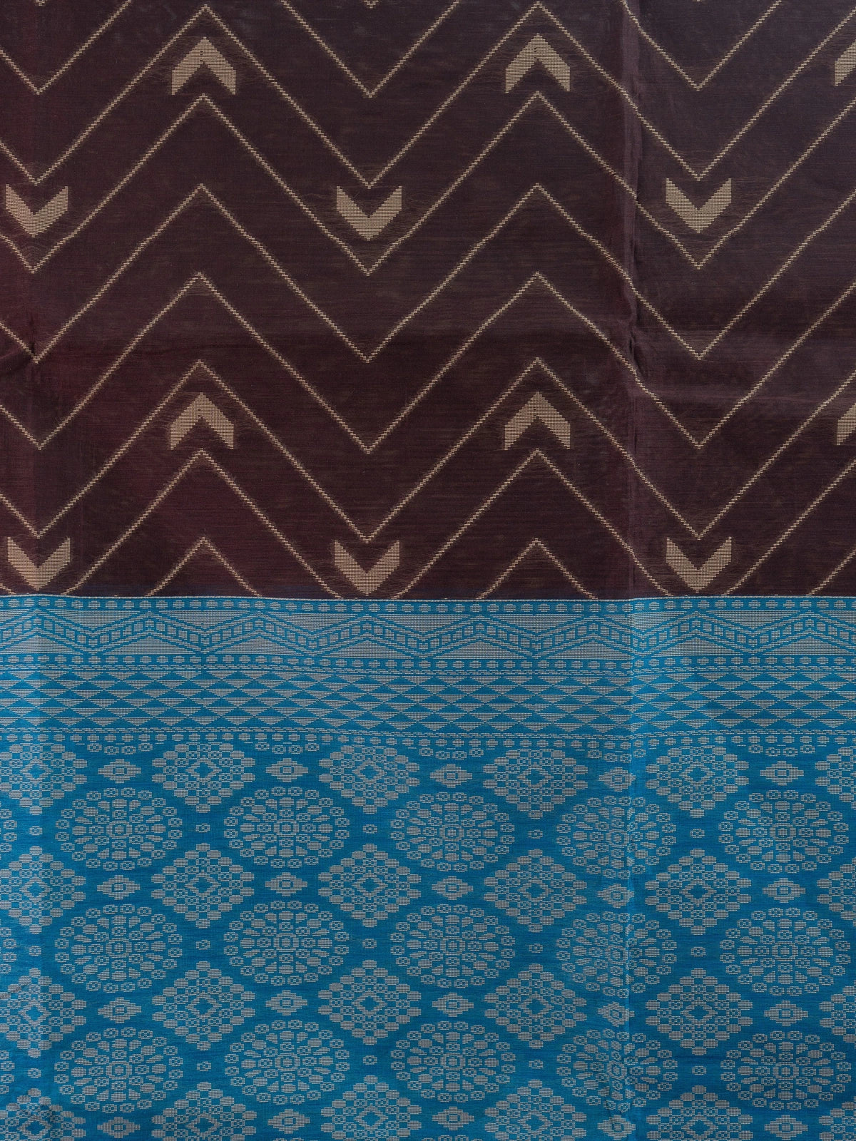 Dark brown silk cotton saree with chevron woven body and contrast peacock blue geometric pallu