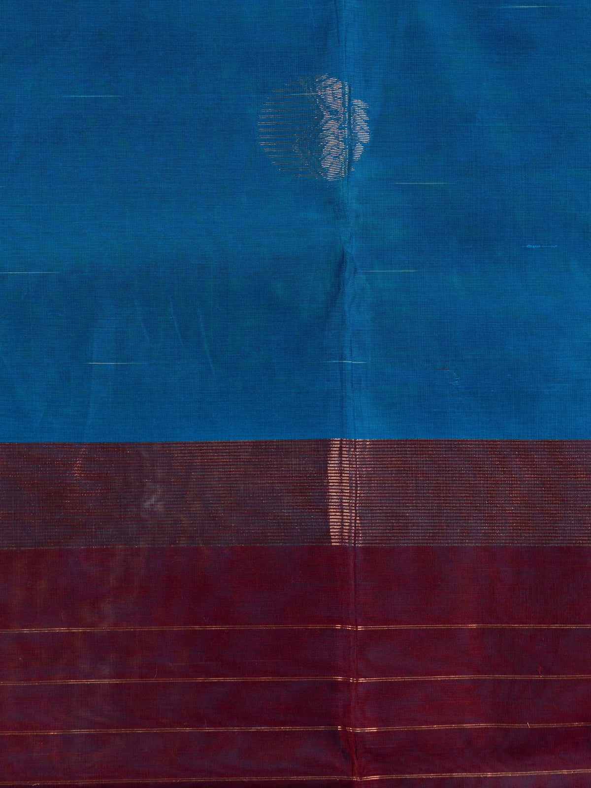 Peacock blue silk cotton saree with maroon contrast zari border and woven butta motifs