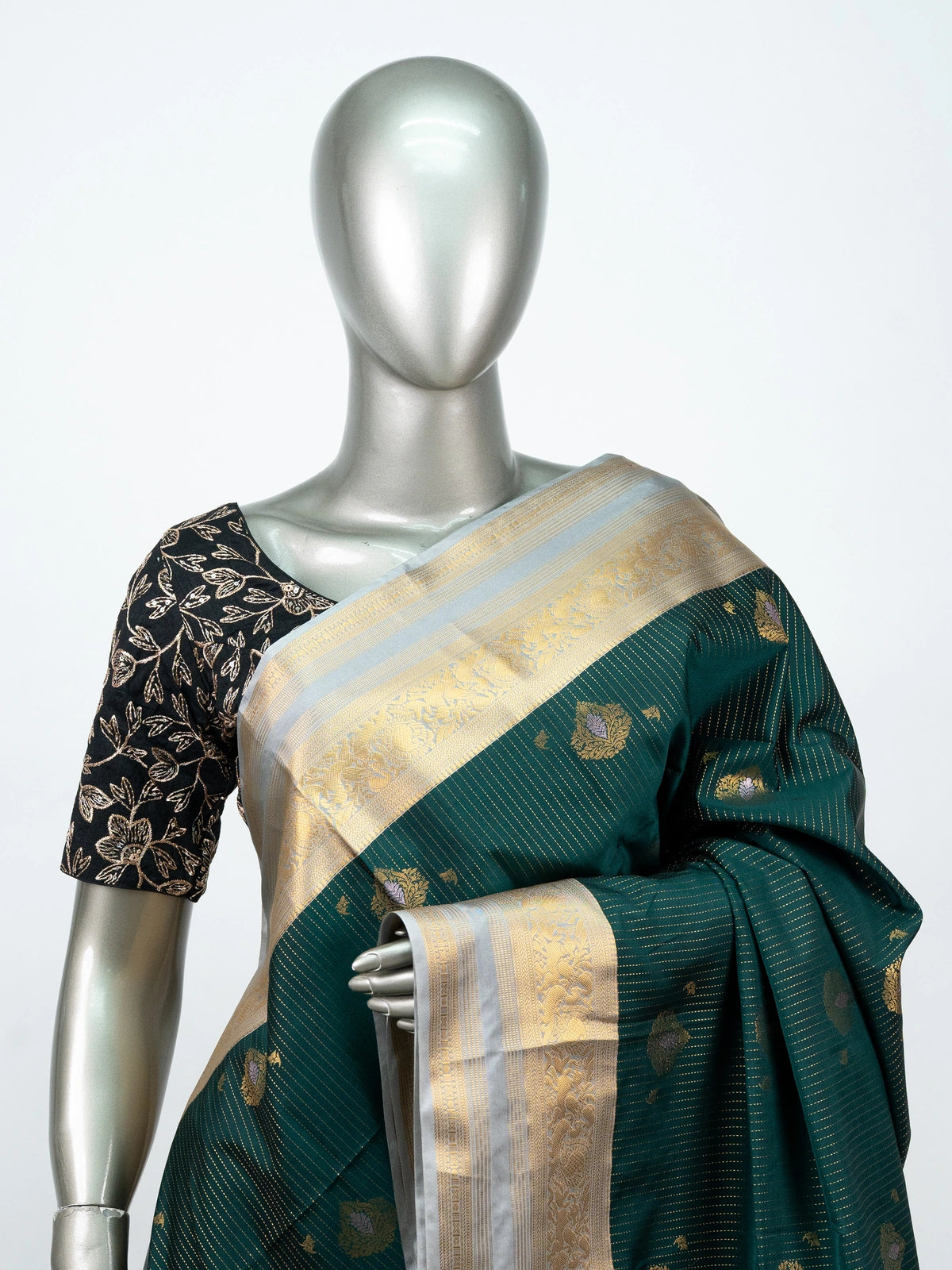 Bottle green Vaira Oosi Design semi silk saree with silver-gold zari border and contrast cream pallu