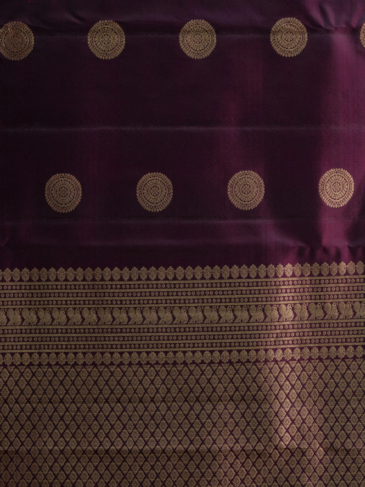 Deep purple pure Kanchipuram silk saree with gold zari circular buttas and contrast gold zari border