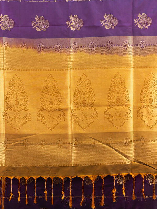 Purple Kanchipuram fancy silk saree with mustard-gold zari border, floral buttas and paisley pallu