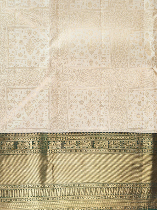 Cream pure Kanchipuram silk saree with gold zari brocade body and contrast dark green and gold border and pallu