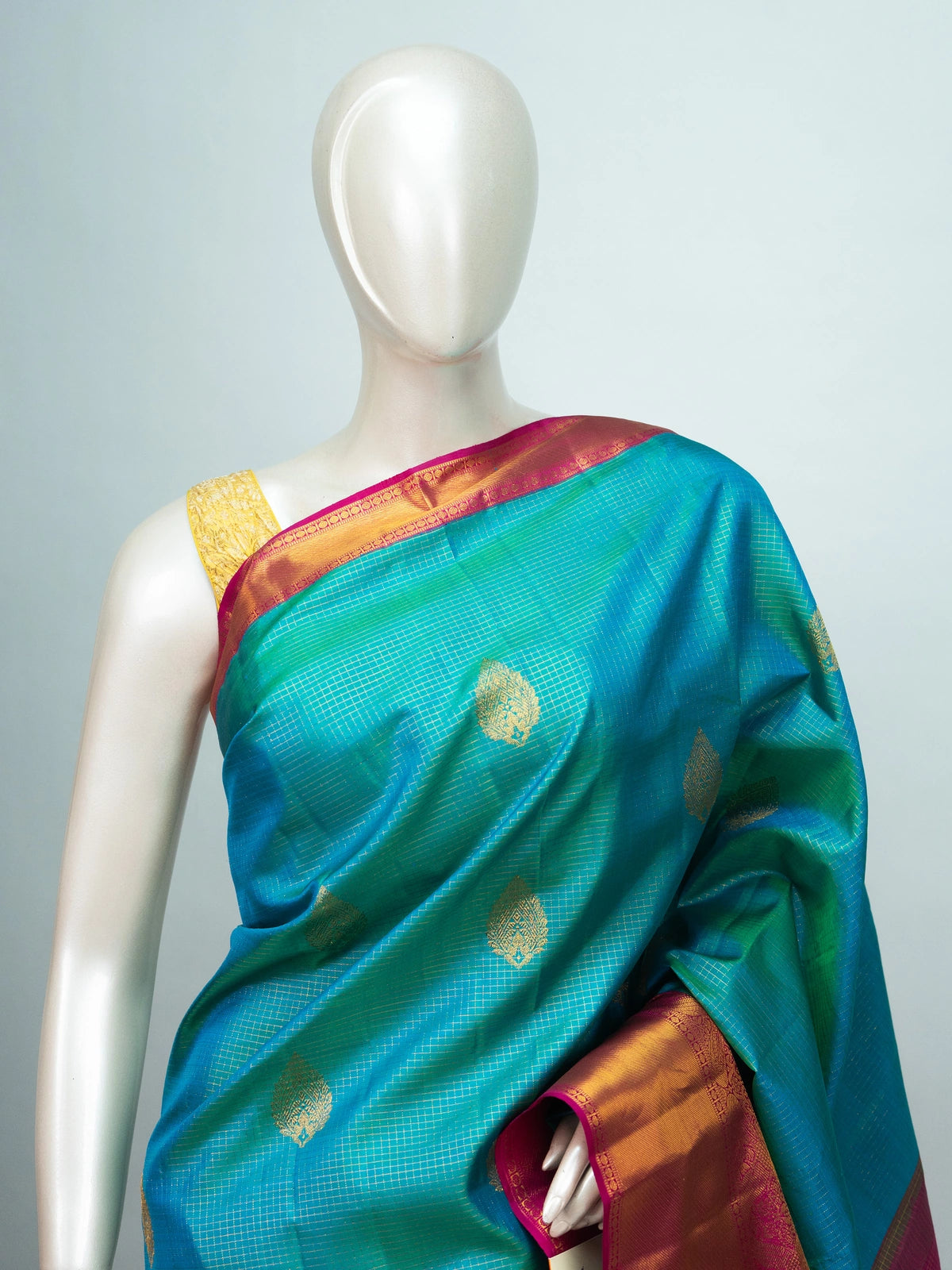Peacock teal pure Kanchipuram silk saree with gold zari checks, woven buti motifs and contrast pink zari border