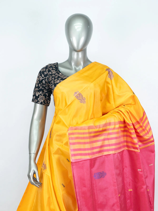 Mustard yellow banana silk saree with contrast pink striped pallu and woven buttas