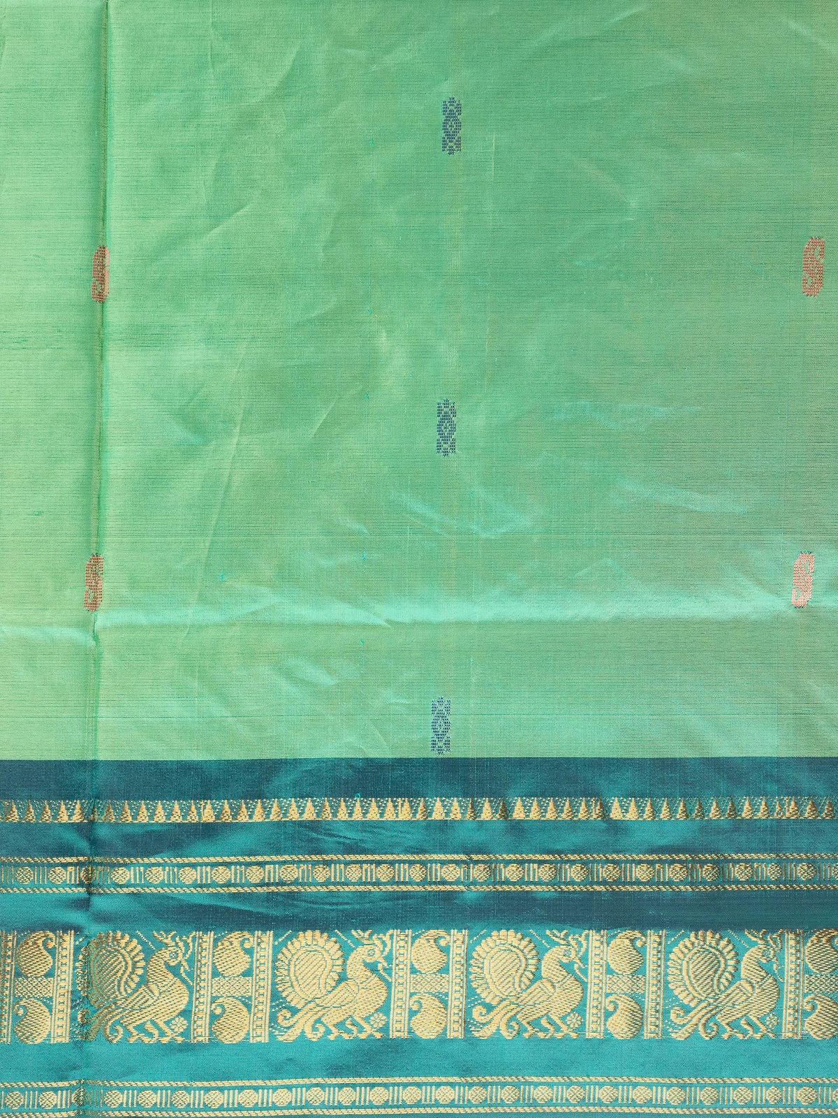 Green banana silk saree with teal gold zari peacock border and contrast maroon pallu