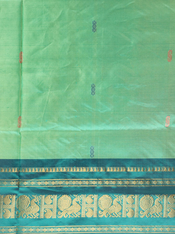 Green banana silk saree with teal gold zari peacock border and contrast maroon pallu