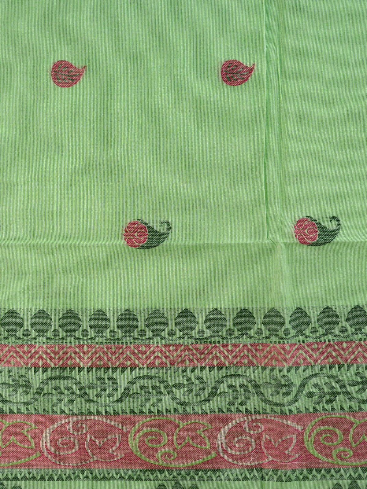 Light green silk cotton saree with pink paisley buttas, contrast grey-green border, and woven floral pallu