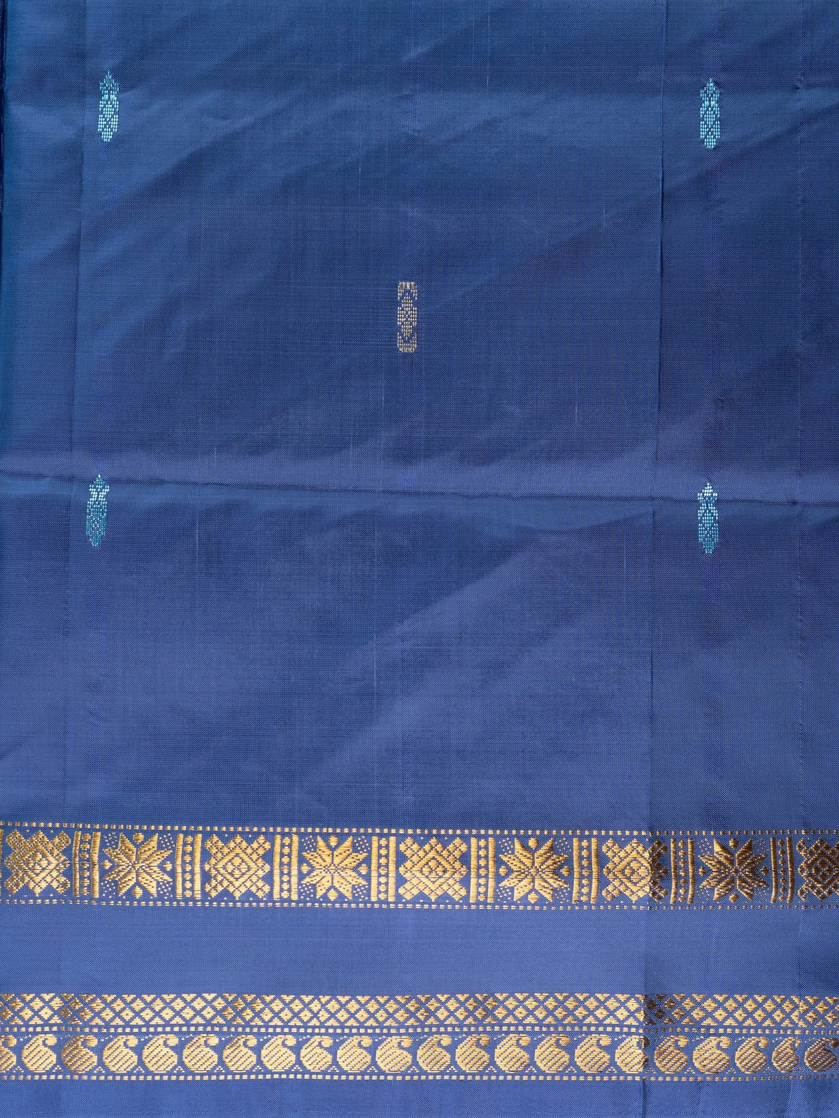 Navy blue banana silk saree with gold zari border and contrast grey pallu