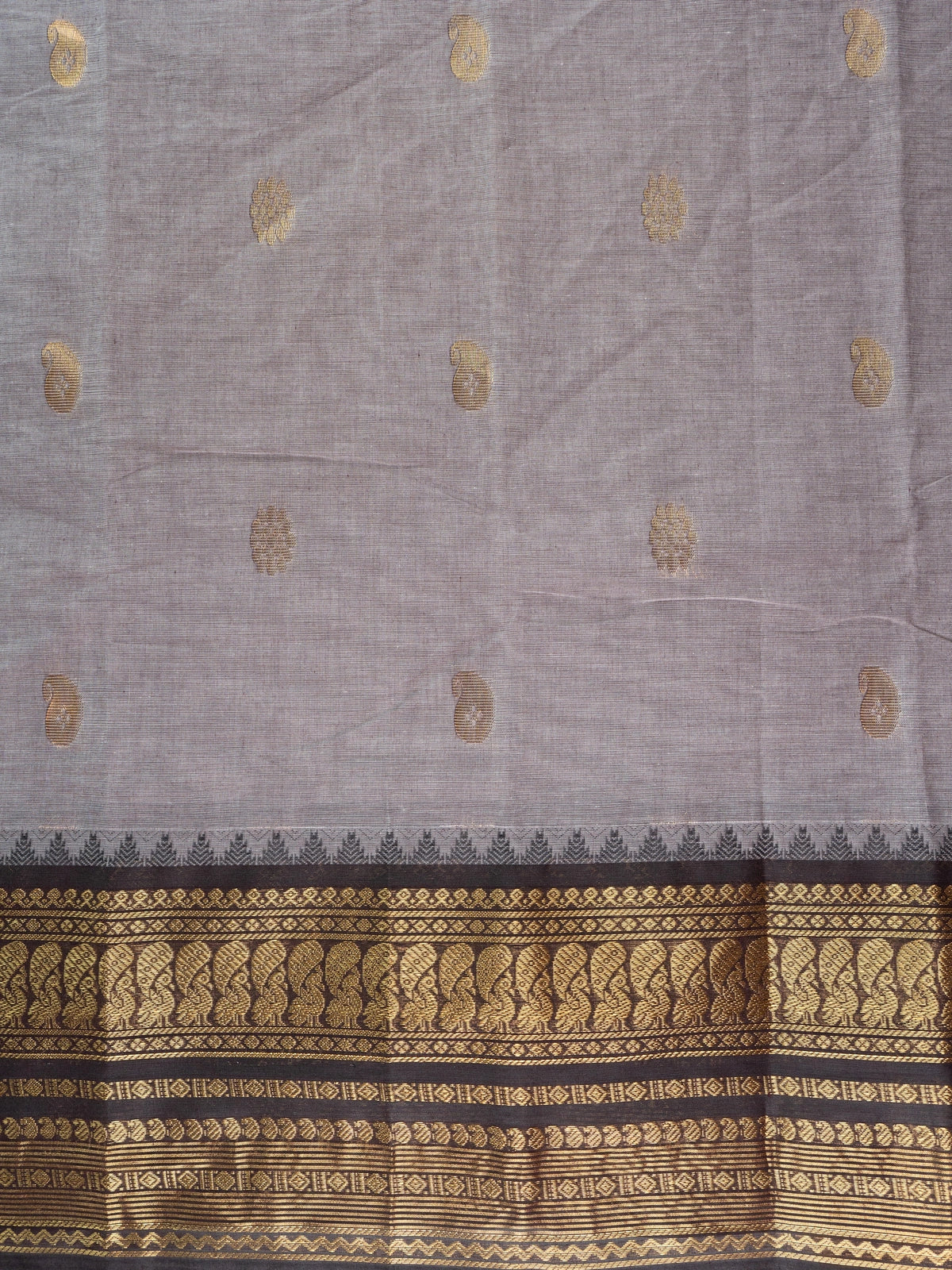 Grey Chettinad cotton saree with black contrast border and gold zari paisley buttas