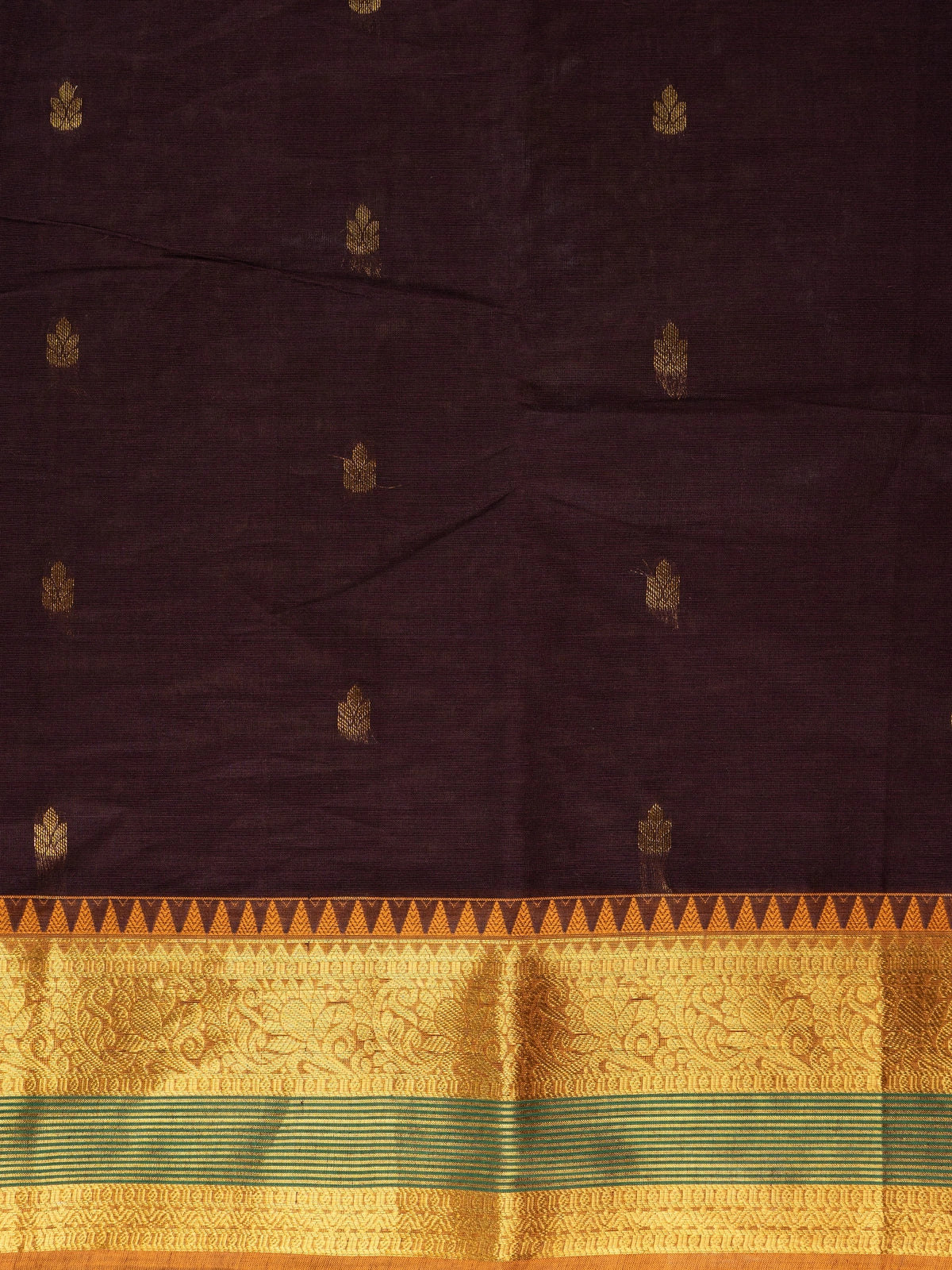 Maroon brown Chettinad cotton saree with mustard-gold zari border, green stripe accents and gold buti motifs