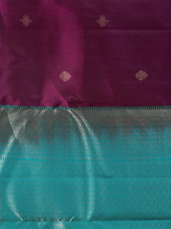 Purple pure Kanchipuram silk saree with teal contrast border and silver zari buti motifs
