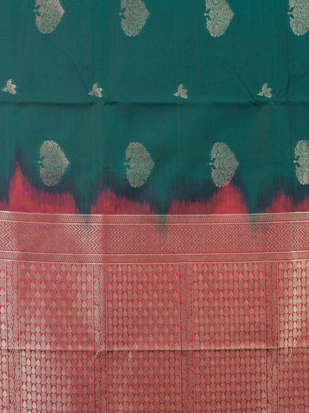 Bottle green semi silk saree with contrast maroon gold zari border and buttas