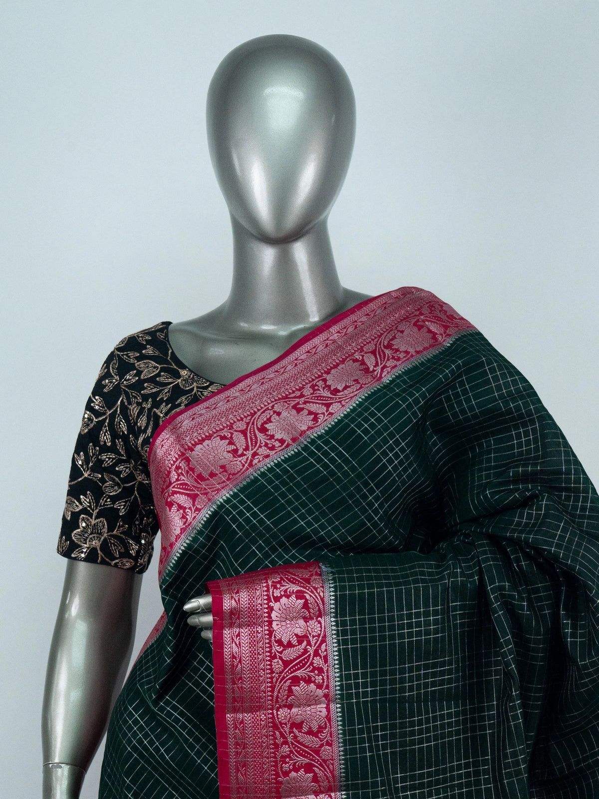 Bottle green semi raw silk saree with silver zari checks and contrast pink floral zari border