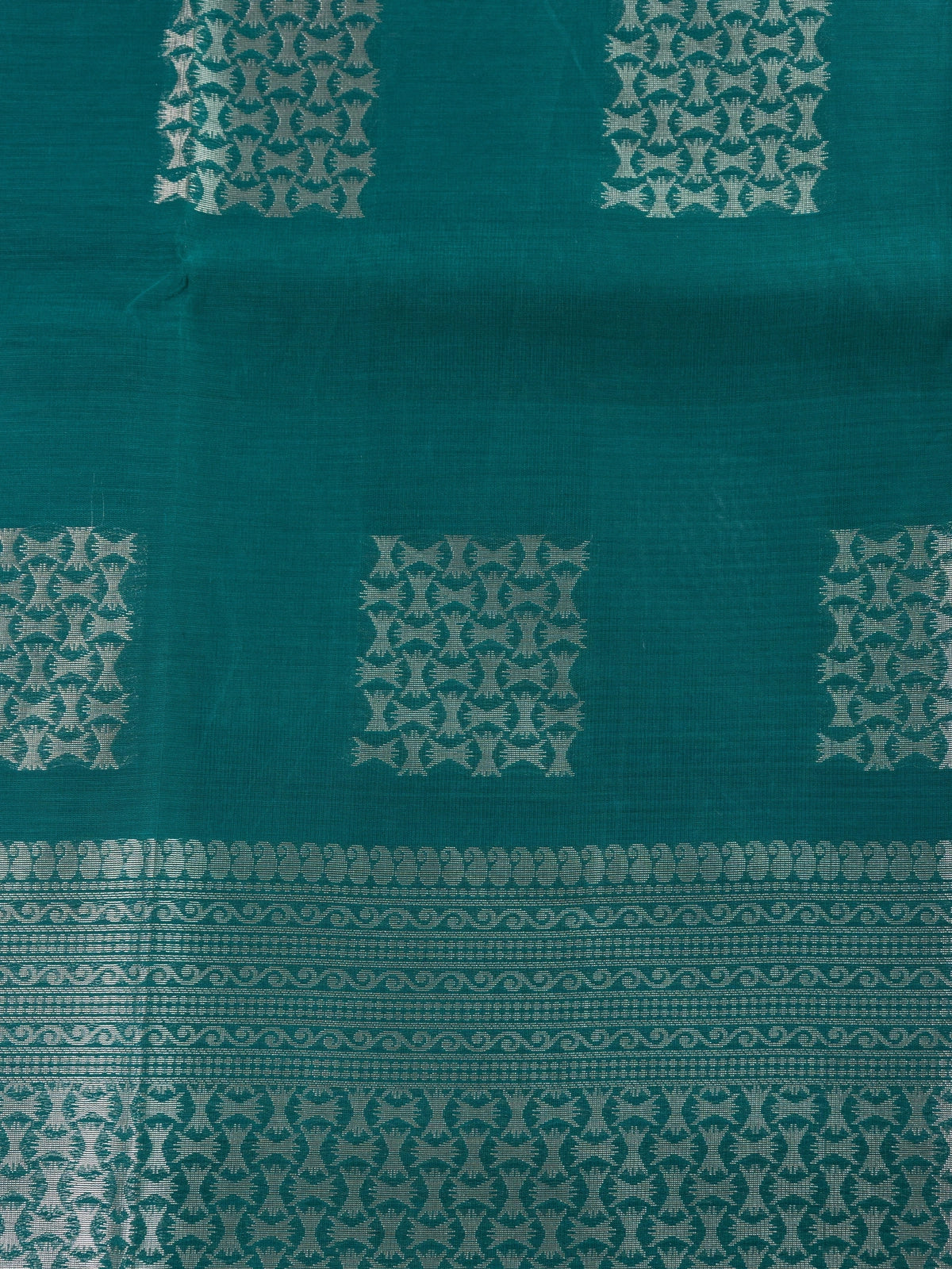 Teal green silk cotton saree with silver zari butta and contrast maroon border