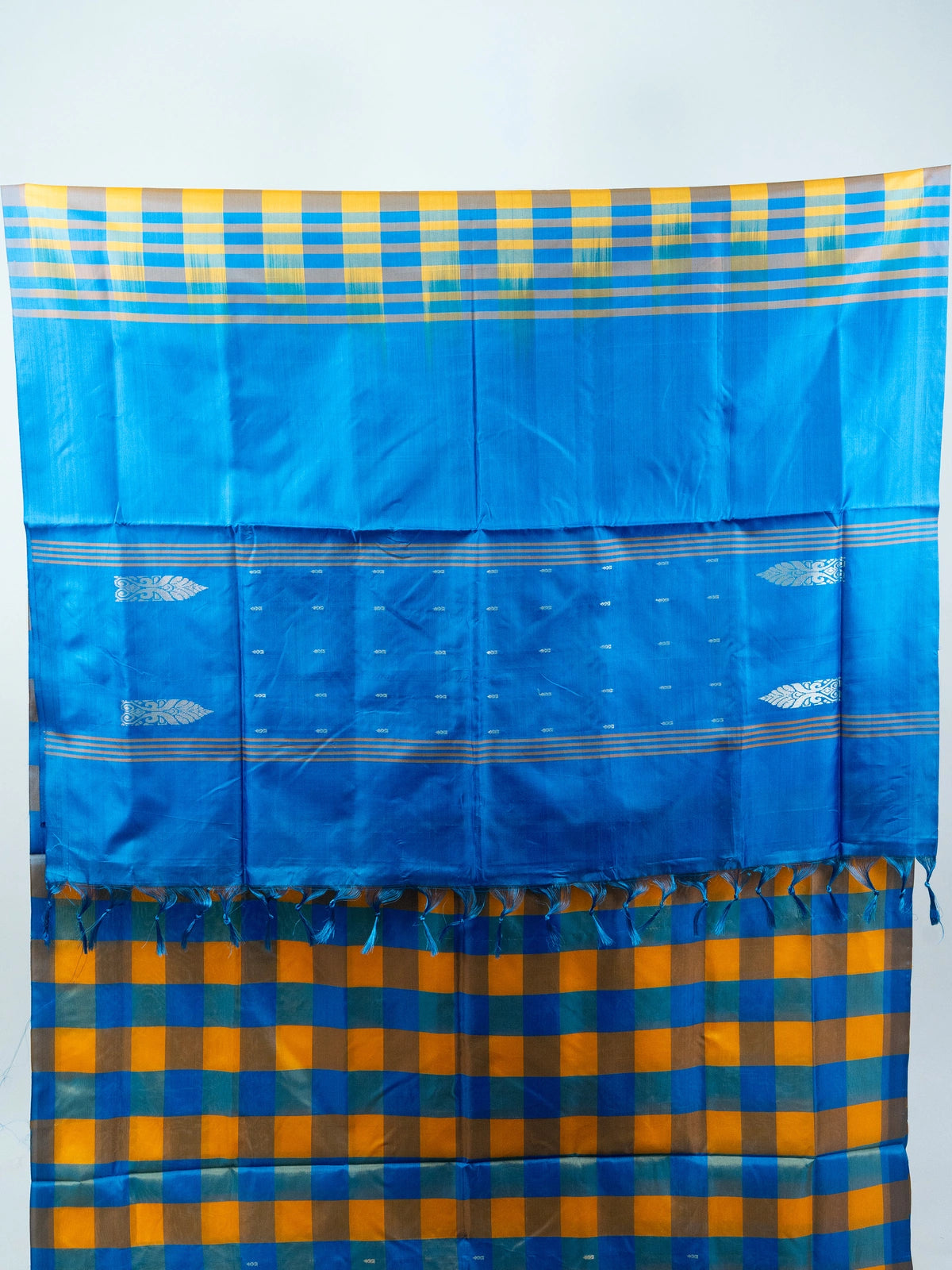 Blue and yellow checked banana silk saree with solid blue pallu and silver zari motifs