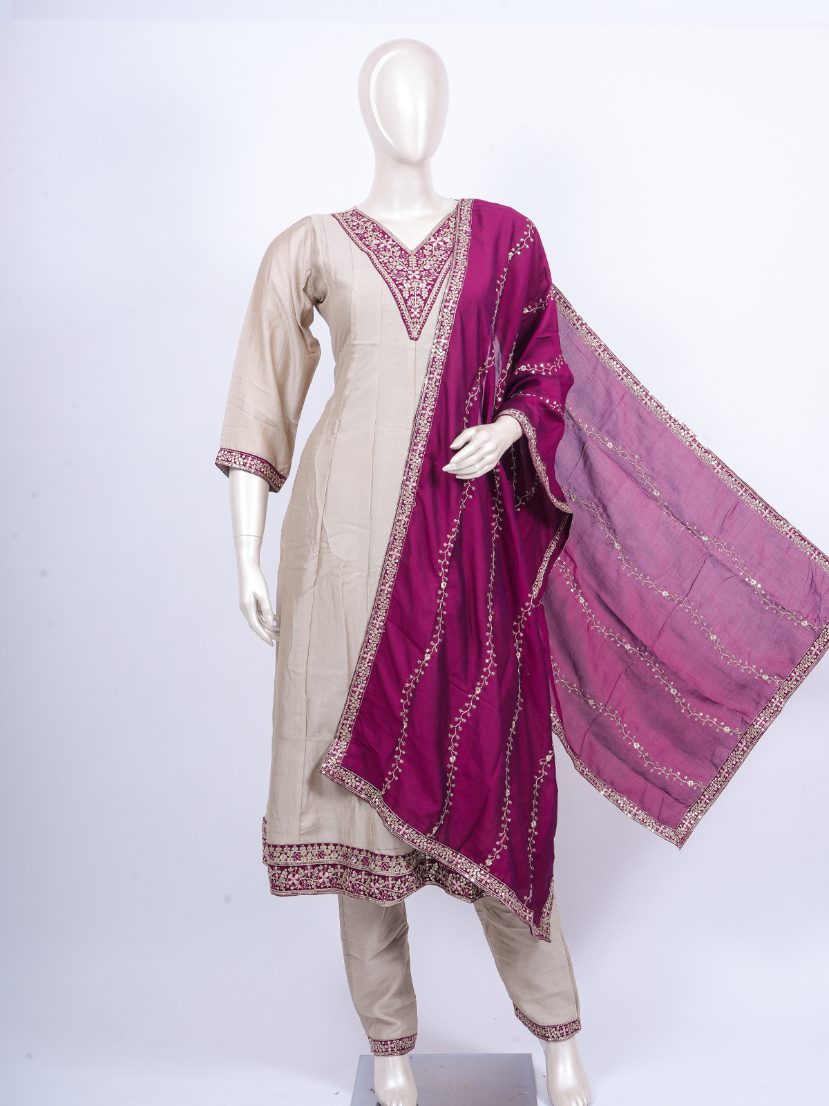 Beige straight-cut kurti set with zari embroidery and contrasting magenta embroidered dupatta
