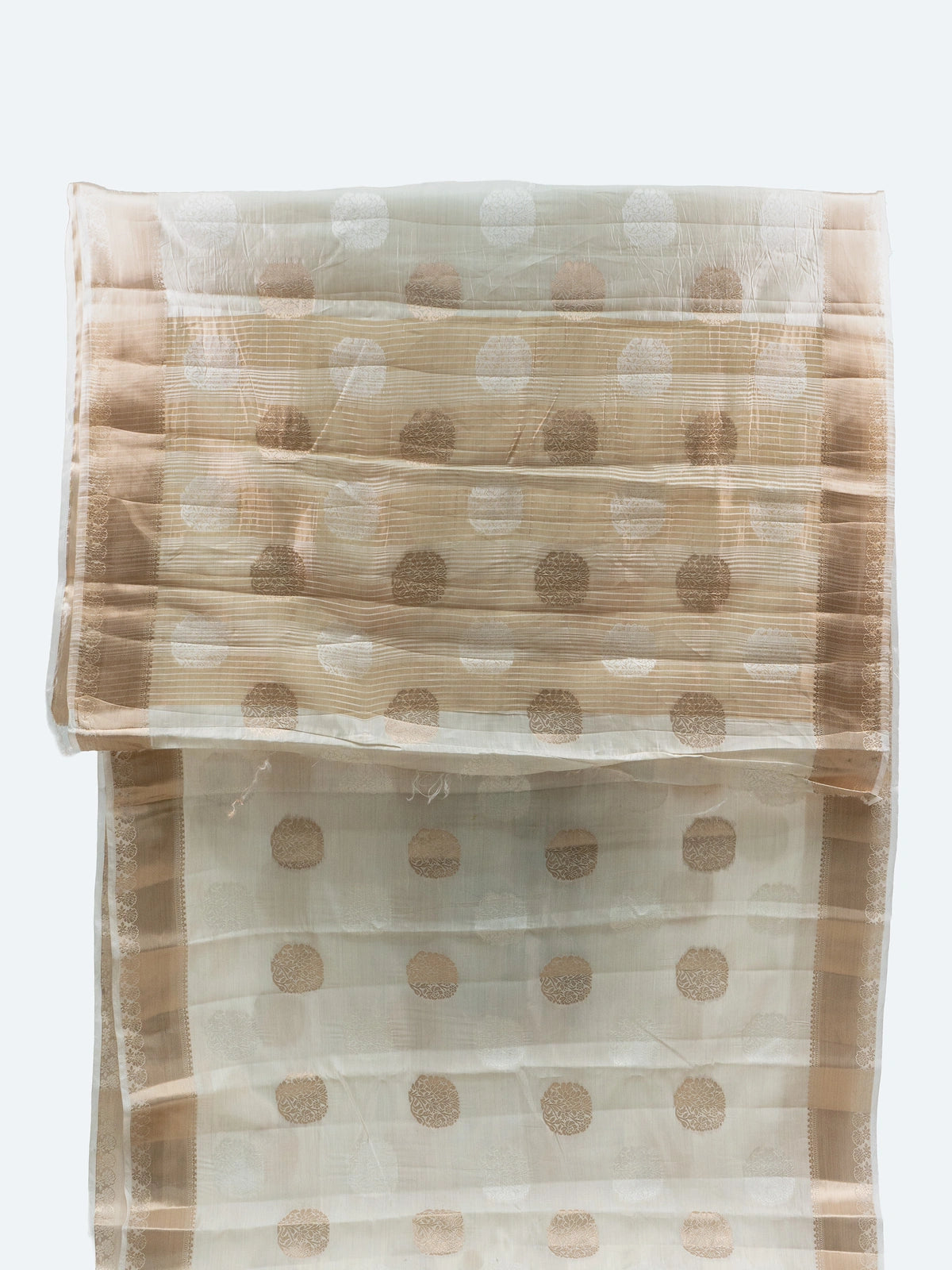 Cream semi raw silk saree with gold zari buttas, gold zari border and contrast black embroidered blouse