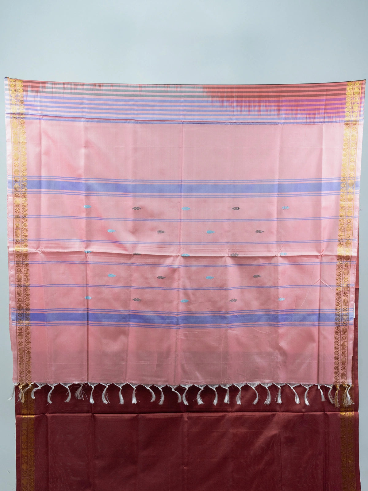 Maroon banana silk saree with contrast pink striped pallu and gold zari border
