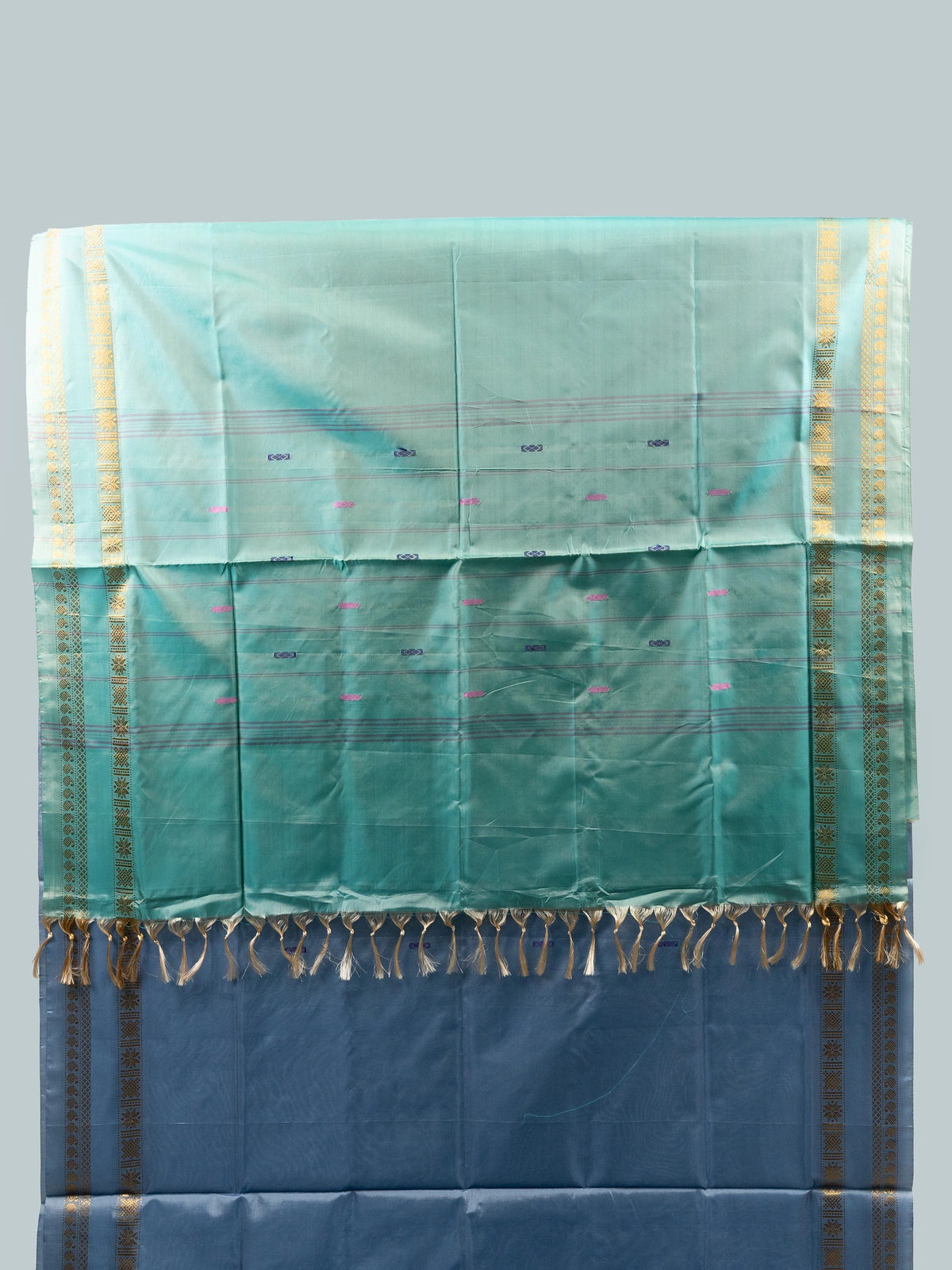 Dusty blue-grey Banana Silk saree with teal green contrast pallu and gold zari border