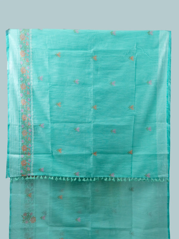Turquoise linen cotton saree with silver zari border, floral embroidered buta and embroidered pallu, styled with a black blouse