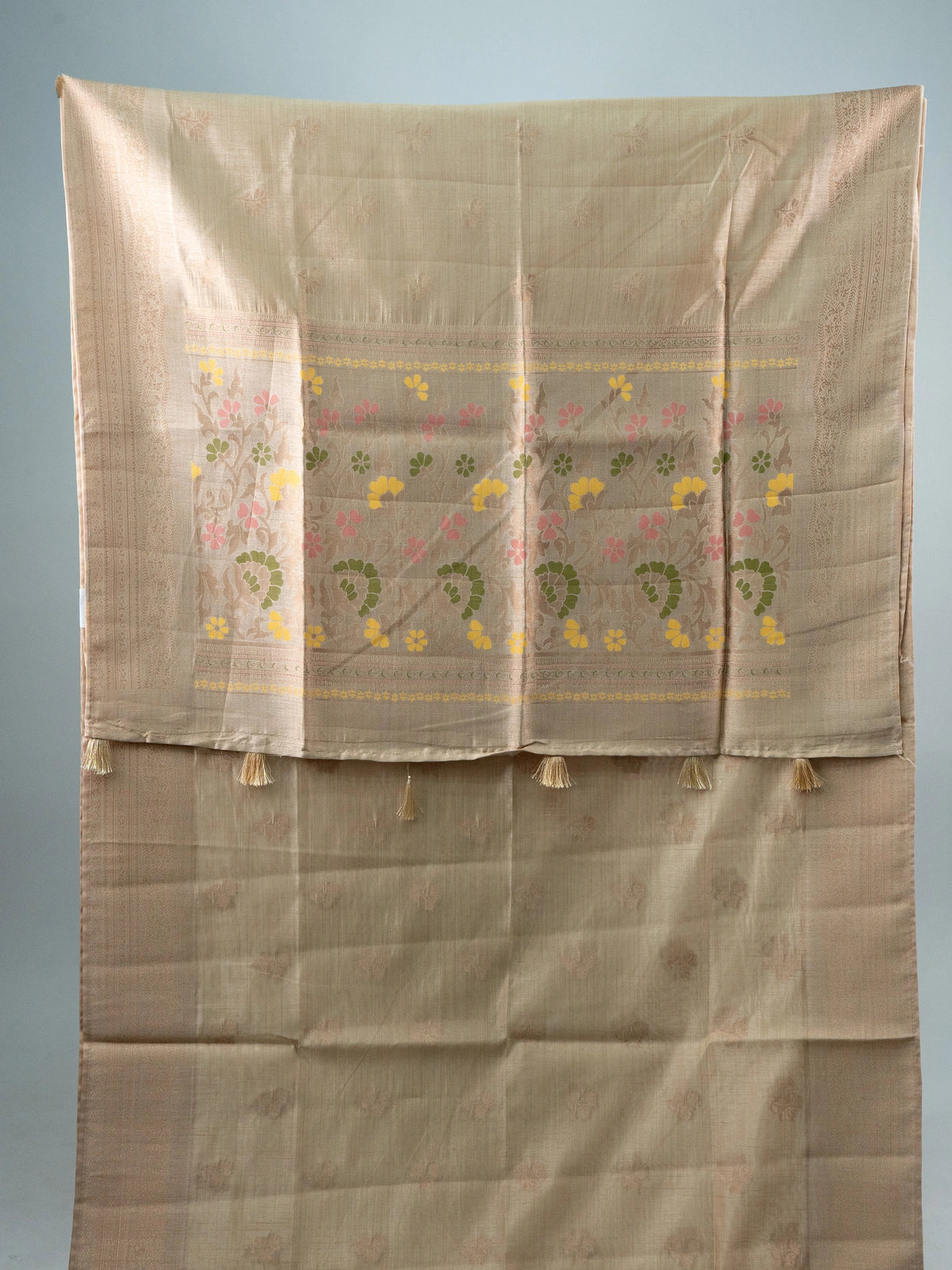 Beige semi raw silk saree with copper zari border and multicolour floral meenakari pallu