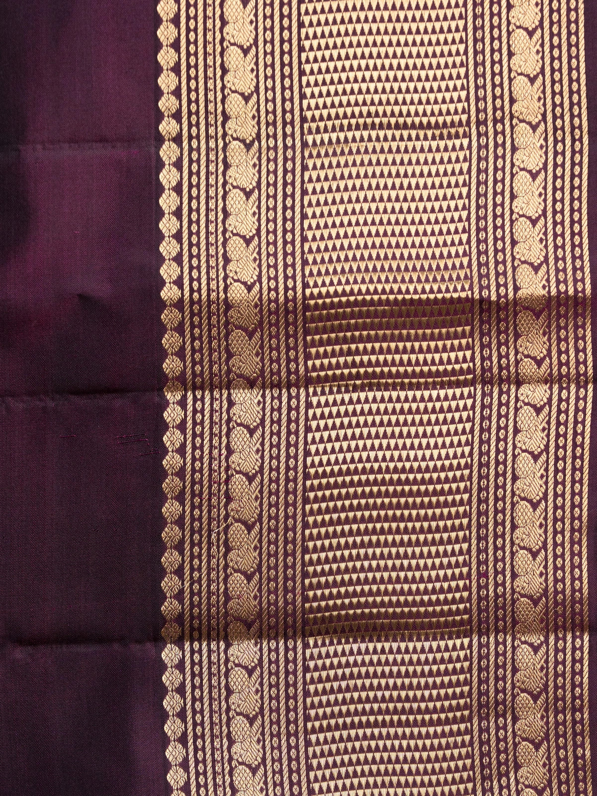 Deep purple pure Kanchipuram silk saree with gold zari circular buttas and contrast gold zari border