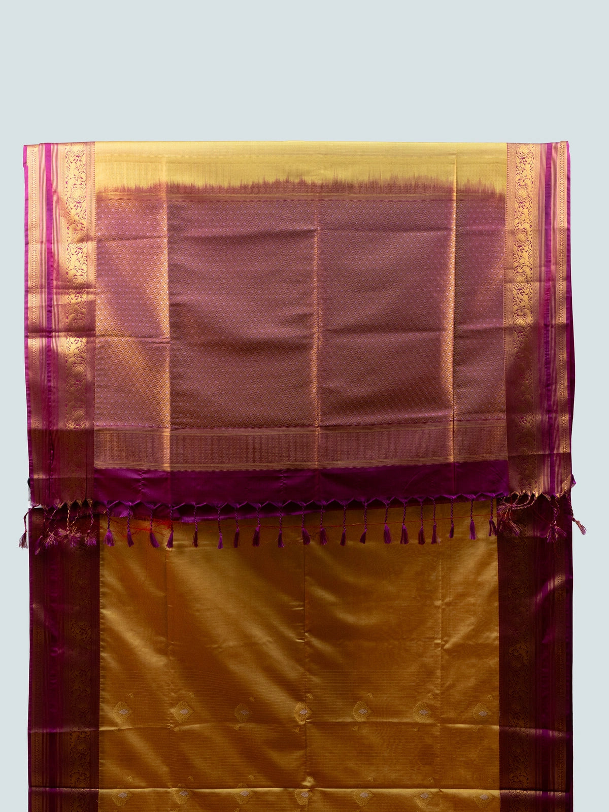 Mustard gold soft silk saree with contrast magenta-purple gold zari border and pallu