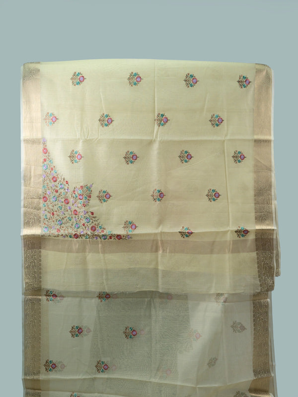 Cream linen cotton saree with gold zari border and multicoloured floral embroidered butas