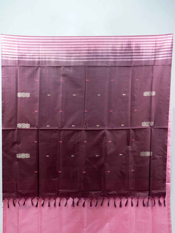 Pink banana silk saree with contrast maroon pallu, woven buti motifs, and black floral blouse