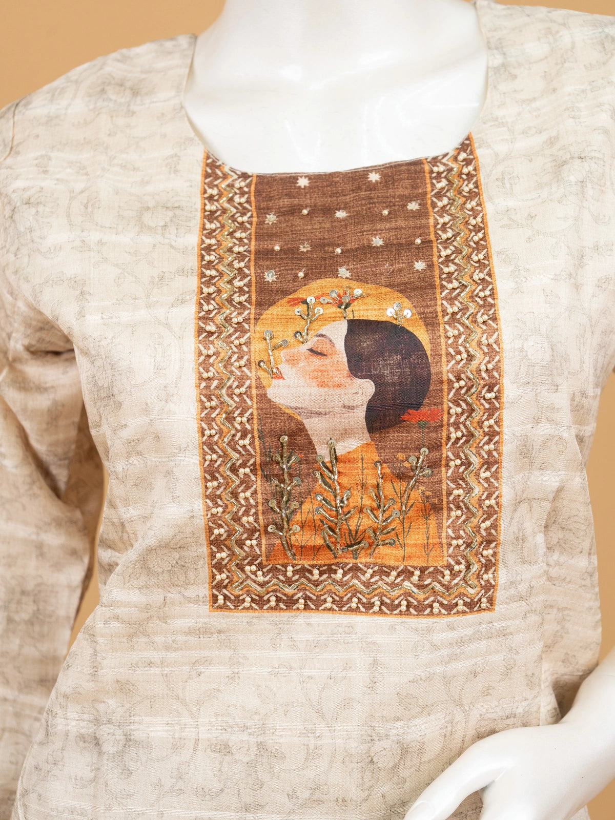 Beige tussar silk straight cut kurti set with artistic printed yoke and contrasting brown embroidered dupatta