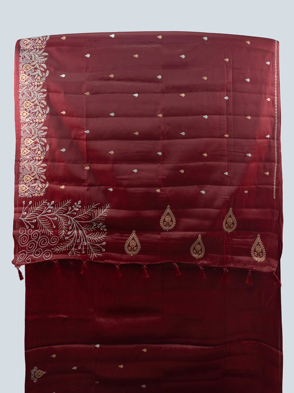 Maroon semi raw silk saree with embroidered pallu, buta motifs and contrast black embroidered blouse