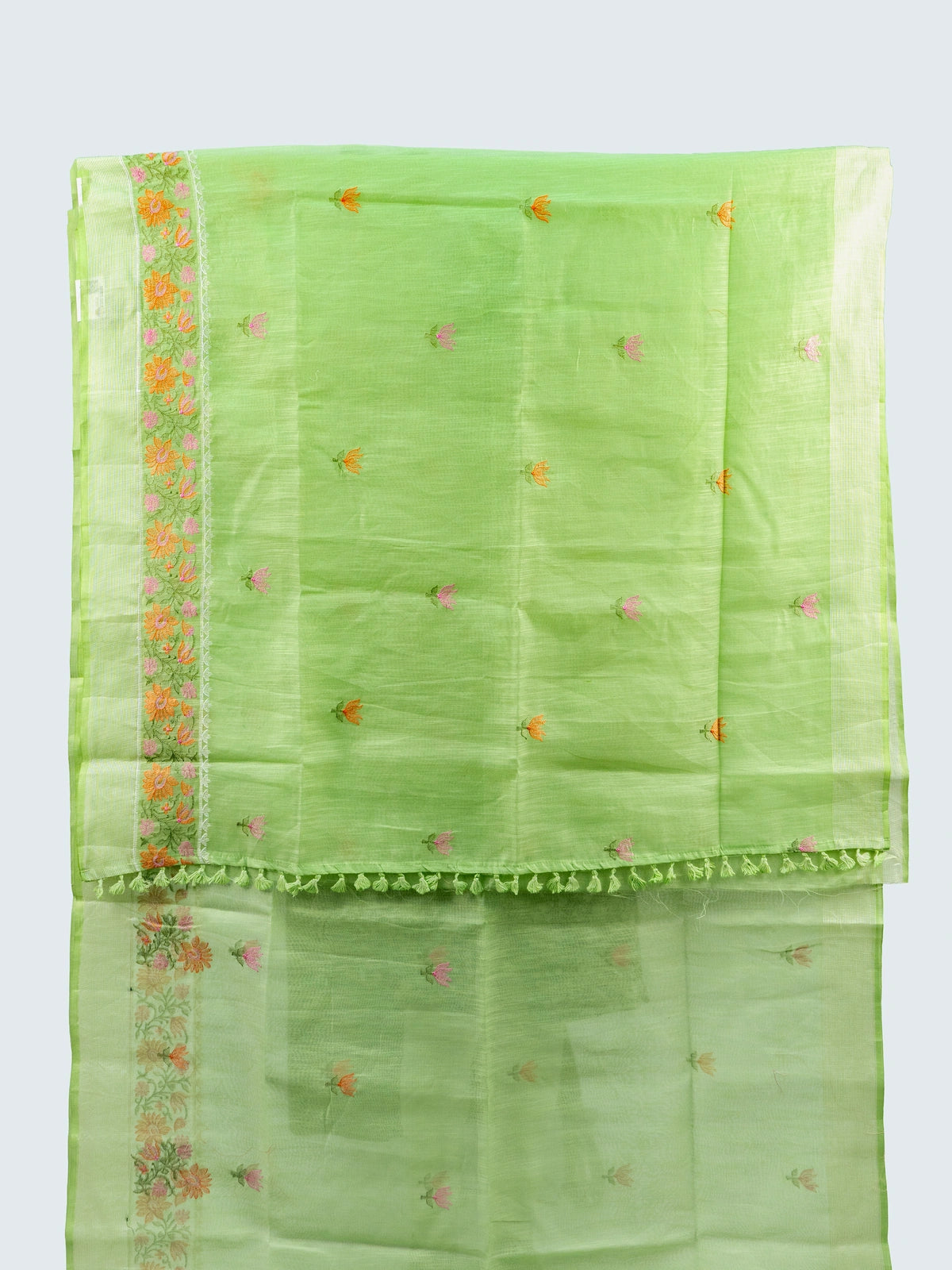 Pista green linen cotton saree with pink and orange floral embroidery and silver zari border