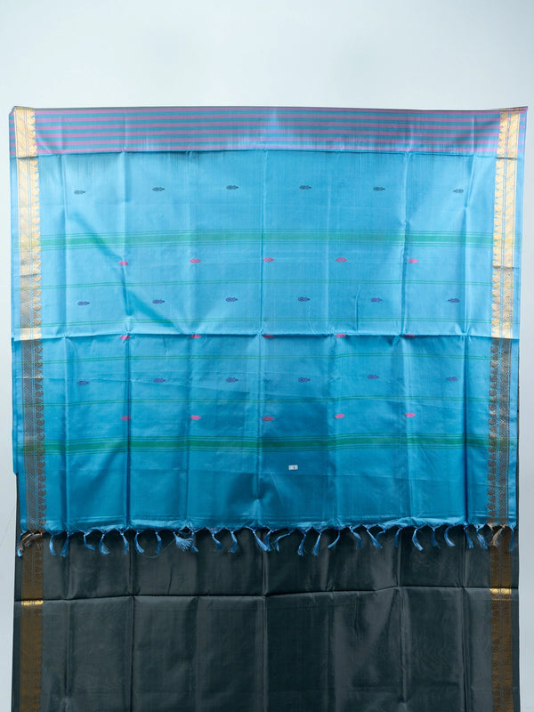 Grey silk saree with contrast blue pallu, gold zari border and black embroidered blouse