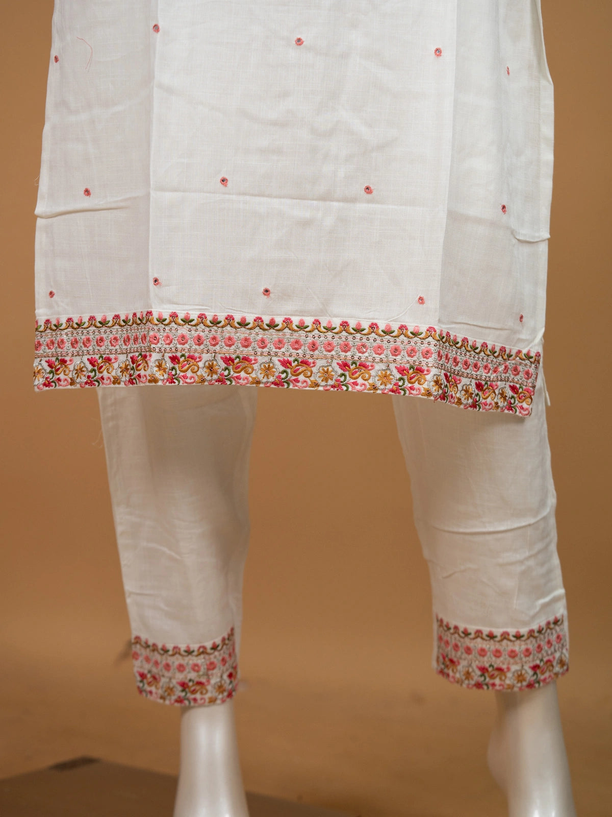 White cotton straight cut kurti set with multicolour embroidered cropped jacket and matching pants
