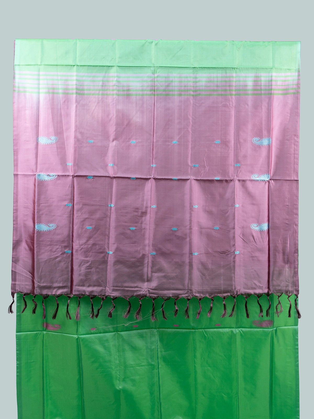 Green banana silk saree with mauve pink contrast pallu, paisley buttas and striped border